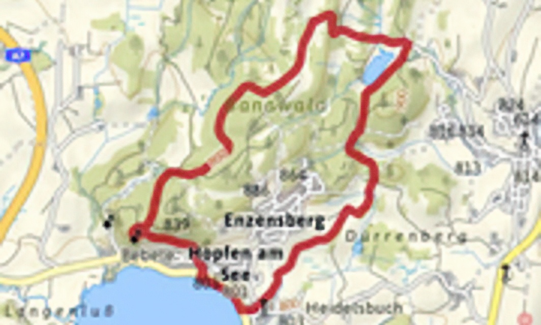 Woodland and meadow path between Hopfen and Lake Faulensee